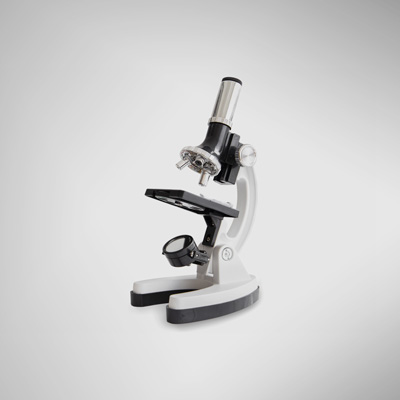 Close-Up of microscope against white background